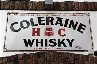 IRELAND, North, Belfast, "Cathedral Quarter, Commerical Court, Old Coleraine Whiskey metal sign