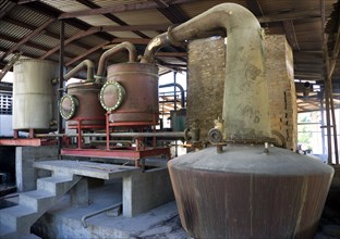 WEST INDIES, Grenada, St Patrick, The wood fired copper stills at the River Antoine rum distillery.
