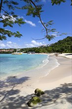 WEST INDIES, Grenada, St George, Gentle waves on BBC Beach in Morne Rouge Bay with tourists in the