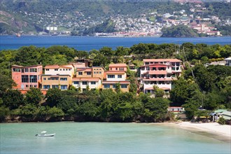 WEST INDIES, Grenada, St George, BBC Beach in Morne Rouge Bay lined with holiday apartment villas