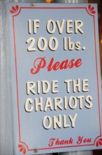 USA, California, Los Angeles, "Carousel warning sign, Santa Monica Pier"