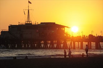 USA, California, Los Angeles, Santa Monica pier Silhouetted at sunset