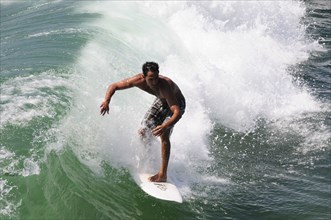 USA, California, Los Angeles, "Surfer riding wave, Venice Beach"