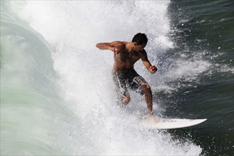 USA, California, Los Angeles, "Surfer riding wave, Venice Beach"
