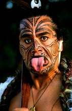 NEW ZEALAND, North Island, Rotorua, Head and shoulders portrait of Maori native man with tattoos
