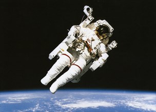 SCIENCE, Space, Nasa, Astronaut floating in orbit above the earth during spacewalk.