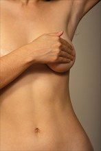 PEOPLE, Women, Health, Cropped shot of woman self examining her breast tissue.