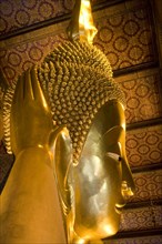 THAILAND, Central, Bangkok, Wat Pho also known as Wat Phra Chetuphon. Close up of the face of the