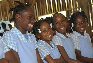 West Indies, Haiti, Isla Laganave, Young School Girls in Blue uniforms