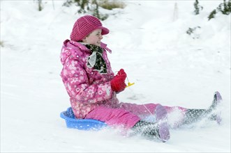 WEATHER, Winter, Snow, "Young girl sledding down hill. Perth, Scotland. "