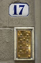 ITALY, Tuscany, Florence, No 17 Door Number and Brass Bell Plaque