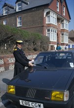 LAW AND ORDER Police Traffic Warden Car being given a parking ticket Automobile