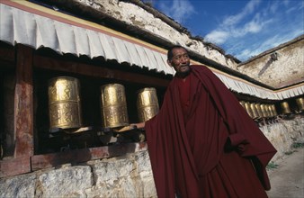 CHINA Tibet  Lhasa Monk turning prayer wheels at Sera MonasteryAsia Chinese Chungkuo Jhongguó