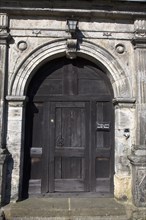 England, West Sussex, East Grinstead, wooden door of Sackville College a former Alms house built