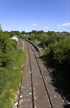 Transport, Railway, Disused track and platform in country village.