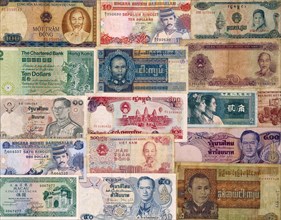 Business, Finance, Money, Display of foreign currency notes from Southeast Asian countries.
