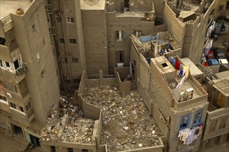Environment, Litter, Aerial view looking down on building rooftops covered in rubbish in Cairo,