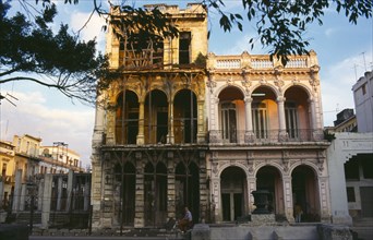 CUBA, Havana, Old Havana, Prado district building facades in various states of disrepair.