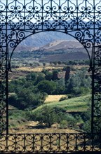 MOROCCO, High Atlas Mountains, Telouet, The Dar glaoui kasbah. View through an arched window with