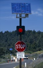Environment, Solar Power, USA, California.  Solar powered red warning light on traffic light next