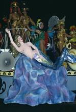 Cuba, Matanzas, Varadero, Carnival float decorated with a papier mache mermaid with people in