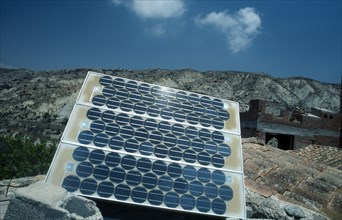 Environment, Alternative Energy, Solar Panel, Modern solar panel perched on traditional tiled