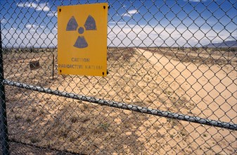 USA, New Mexico, Trinity, Site of first nuclear test in 1945 with warning signs on surrounding wire