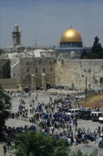 Israel, Jerusalem, Gold dome of the Aska Mosque and western or Wailing Wall with crowds of