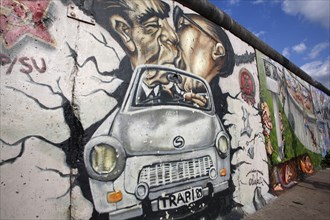 Germany, Berlin, Mural of Erich Honecker & Leonid Brezhnev kissing in a car, East Side Gallery,