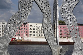 Germany, Berlin, Detail of Molecule Men sculpture 30 metres in height by Jonathan Borofsky on River