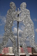 Germany, Berlin, Molecule Men sculpture 30 metres in height by Jonathan Borofsky on River Spree.