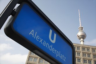 Germany, Berlin, Alexanderplatz, U Bahn sign for Alexanderplatz with Fernsehturm & office building