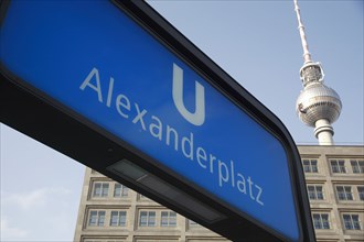 Germany, Berlin, Alexanderplatz, U Bahn sign for Alexanderplatz with Fernsehturm & office building