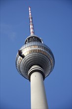 Germany, BErlin, Fernsehturm communicatiosn tower and blue sky.