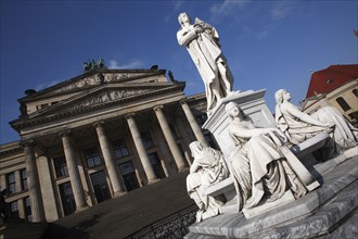 Germany, Berlin, Gendermenmarkt, Schiller Monument with the concert hall in the background to the