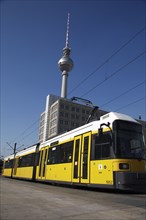 Germany, Berlin, Tram at Alexanderplatz with Fernsehturm in background.