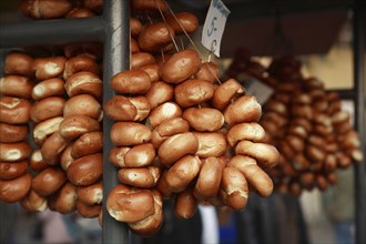 Poland, Krakow, Bread rolls for sale from street vendor's stall.