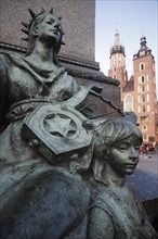 Poland, Krakow, Detail of female figure & child on monument to the polish romantic poet Adam