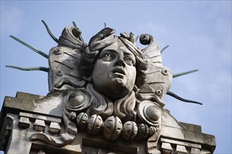 Poland, Krakow, Head of Apollo on top of the entrance to the Palace of Arts built in 1901 for the