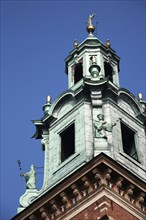 Poland, Krakow, Detail of clock tower on Wawel Cathedral.