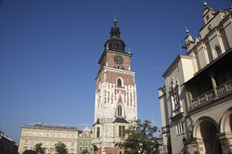 Poland, Krakow, Old Town Hall in the Rynek Glowny market square with part of the Cloth Hall to the