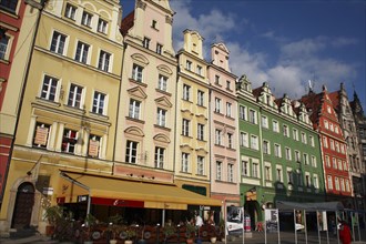 Poland, Wroclaw, pastel coloured building facades in the Rynek old town square.