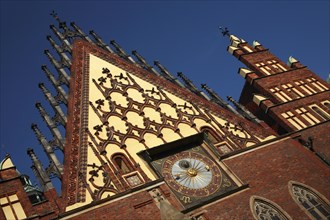 Poland, Wroclaw,Town Hall with decorative gable, red  brickwork & sundial.