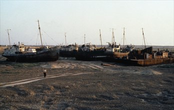 Uzbekistan, Karakalpakstan, Muinak, Aral Sea.  Ships cemetery on city outskirts formally on sea