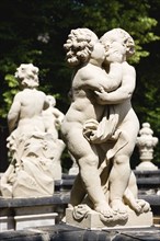 GERMANY, Saxony, Dresden, Statue of two kissing cherubs in the restored Baroque Zwinger Palace