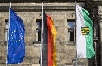 GERMANY, Saxony, Dresden, The flags of the EU European Union, Germany and Saxony flying from