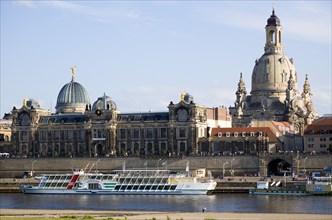 GERMANY, Saxony, Dresden, The city skyline with cruise boats moored on the River Elbe in front of