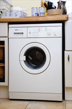 Architecture, Interiors, machinery, White domestic washing machine household appliance set under