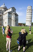 ITALY, Tuscany, Pisa, Campo dei Miracoli or Field of Miracles Tourists in front of the Duomo