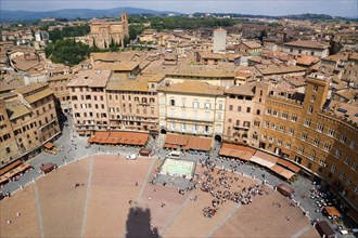 ITALY, Tuscany, Siena, Shadow of the Torre del Mangia campanile belltower in the Piazza del Campo